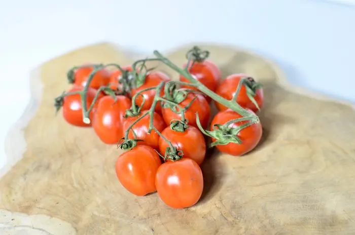 Ripe tomatoes on a wooden board