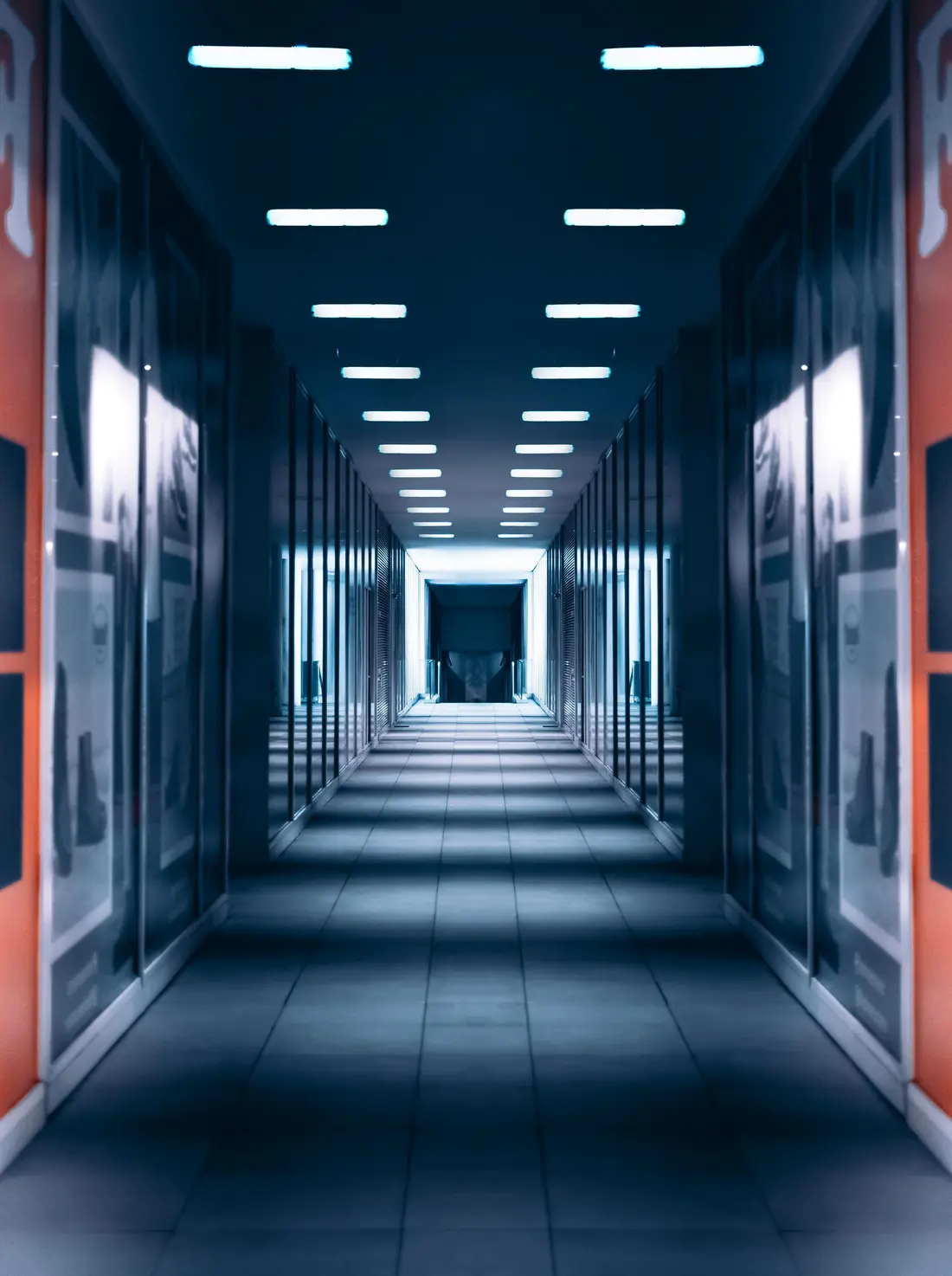 A quiet, softly lit data center corridor